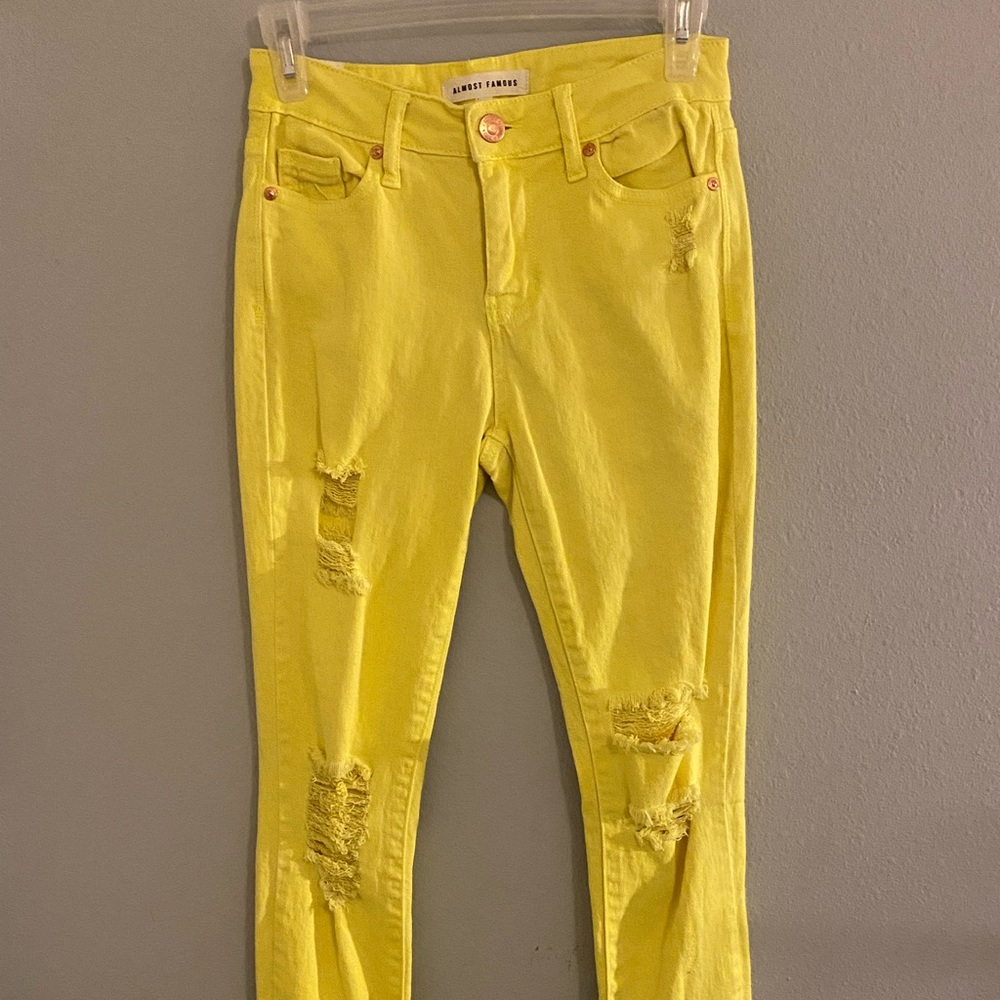 Neon yellow distressed jeans. Size 1